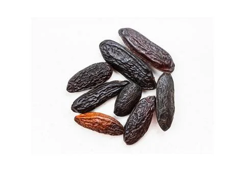 Pile of wrinkled dates on white background Stock Photos