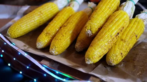 A pile of yellow corn on a table Видео 317260072