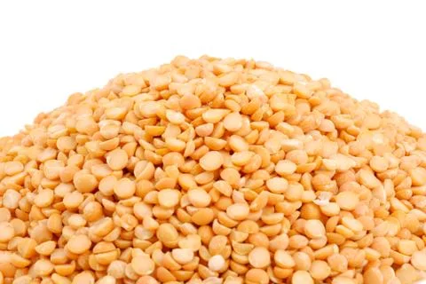 Pile of yellow split peas on white Stock Photos