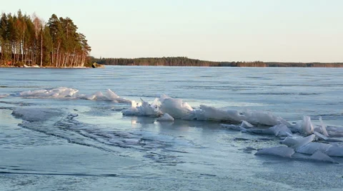 Piled ice at a crack on ice-covered lake Stock Footage 37162198