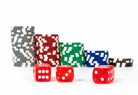 Piled poker chips with dice Stock Photos