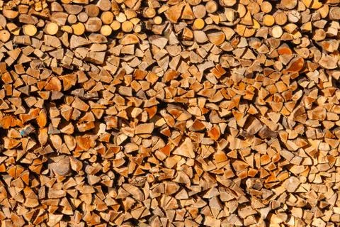 Piled split forest wood logs renewable heat energy Stock Photos