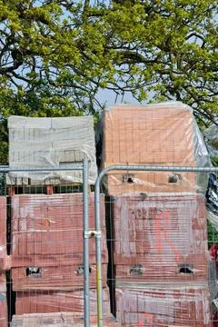 Piles of bricks on construction site Piles of bricks on construction site ... Stockfoto's
