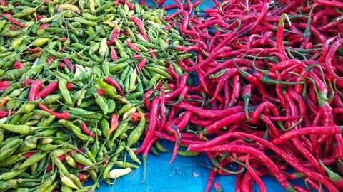Piles of cayenne pepper and red pepper at the farmer's market Stock Footage 288810315
