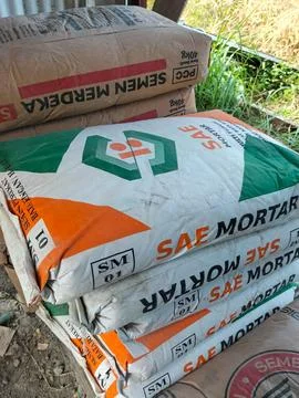 Piles of cement sacks Stock Photos