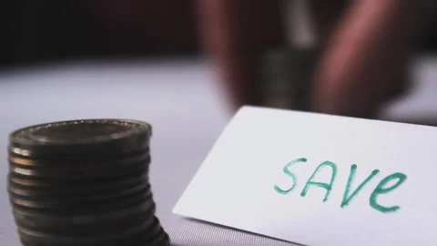 Piles of coins on table, man create fund to save money and family budget economy Stock Footage 203779776