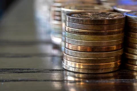 Piles of coins on the table. Stock Photos