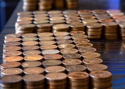 Piles of coins on the table. Stock Photos