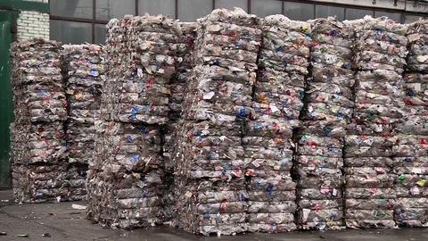 Piles of compressed plastic bottles prepared for recycling Stock Footage 84282360