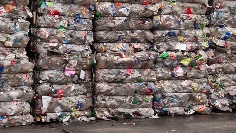 Piles of compressed plastic bottles prepared for recycling Stock Footage 84283934