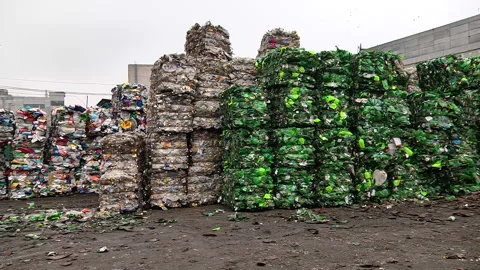 Piles of compressed plastic bottles prepared for recycling Stock Footage 85470737