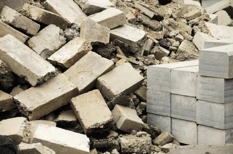Piles of damaged bricks in construction site Stock Photos