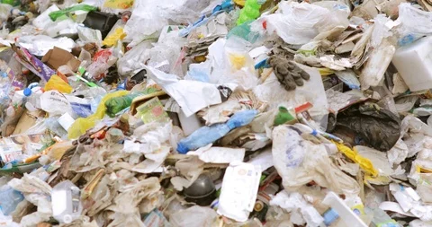 Piles of different plastic and paper garbage for sorting and recycling. Stock Footage 120122097