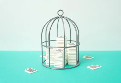 Piles of documents under the cage. Secret files. Protecting corporate and con Stock Photos