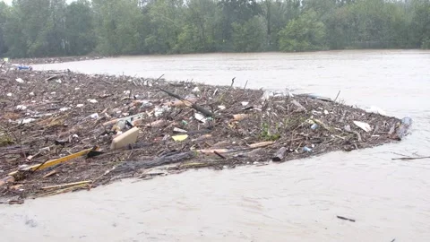 Piles of garbage in the river during flooding after heavy rains in Austria. Stock Footage 284737792