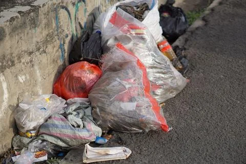 Piles of garbage on the side of the road Fotos de archivo