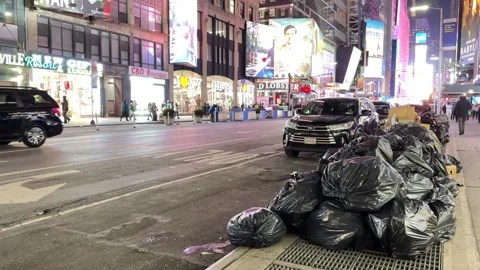 Piles of garbage / waste on Times Square, New York City - 4K Prores 422 Stock Footage 230059554