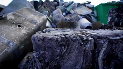 Piles of iron plastic material waste and industrial waste collected for Vídeo Stock 334661999