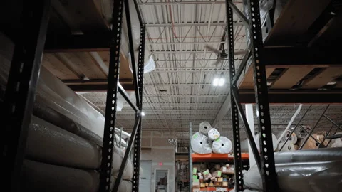 Piles of new rolls of carpet in a store warehouse. Carpet rolls stacked at store Stock-Footage 273724724