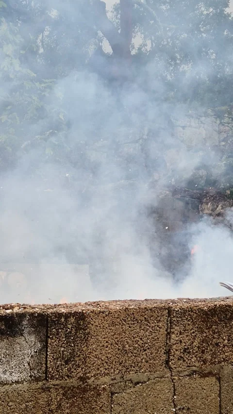 Piles of paper archives and documents burn outdoors in a controlled fire Vídeo Stock 321770309