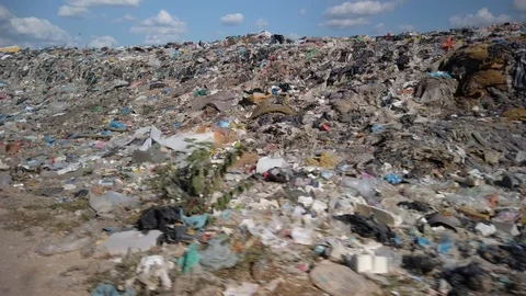 Piles of plastic and garbage at a dump in the countryside. Stock Footage 128813187
