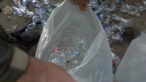 Piles of plastic packaging bottles for recycling at a waste processing plant are Vídeos de archivo 334661232