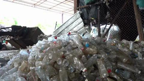 Piles of plastic packaging bottles for recycling waste to be reused as factory 動画素材 334661950