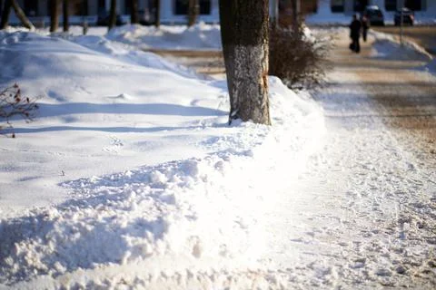 Piles of snow cleared from the sidewalks Foto stock