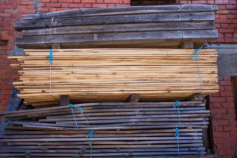Piles stack of timber on construction site Stock Photos