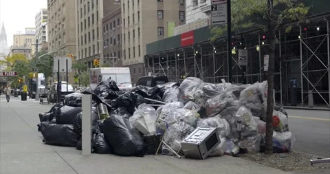 Piles of trash / waste bags on the sidewalk, New York City, Manhattan. 4K Stock Footage