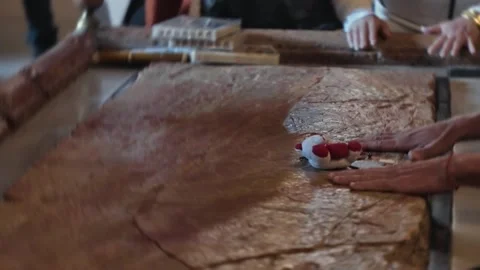 Pilgrim anointing objects on the Stone of Unction in Jerusalem Видео 339205634