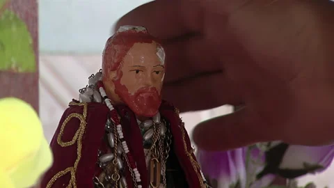 Pilgrim Showing Devotion by Touching Sculpture of San Gil - Close-Up View  Stock Footage 203843534