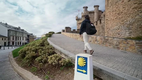 Pilgrim walking the Way of St. James in Ponferrada, Spain Video stock 327619808