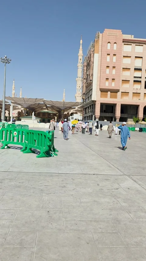 Pilgrims Approaching the Prophet's Mosque Stock Footage 346409748