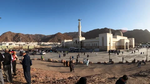 Pilgrims on Archers' Hill Overlooking Sayyid Al-Shuhada Mosque Stock Footage 329055522