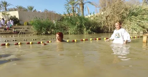 Pilgrims are baptized Stock Footage 77283347