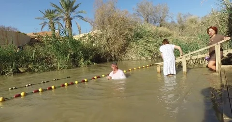 Pilgrims are baptized Stock Footage 77283349