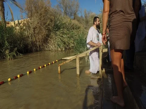 Pilgrims are baptized Stock Footage 77283392