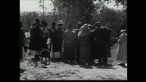 Pilgrims baptize themselves in the Jordan river in this silent film or silent Stock Footage 101704004