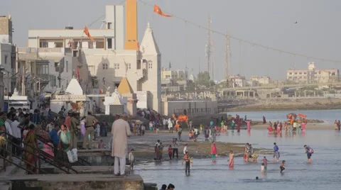 Pilgrims bathing in Gomti river,Dwarka,India Stock Footage 67474540