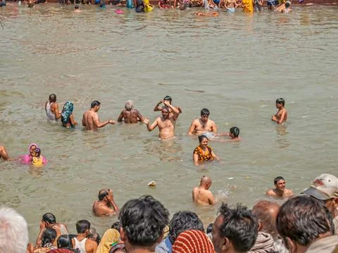 Pilgrims bathing in Haridwar Stock Photos