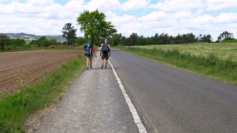 Pilgrims couple walking hyperlapse in nature wild road way, trekking spain Stock Footage 109416971