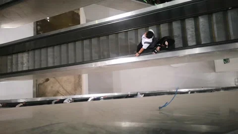 Pilgrims descend from Jamarat building using a group escalator. Stock Footage 130297233
