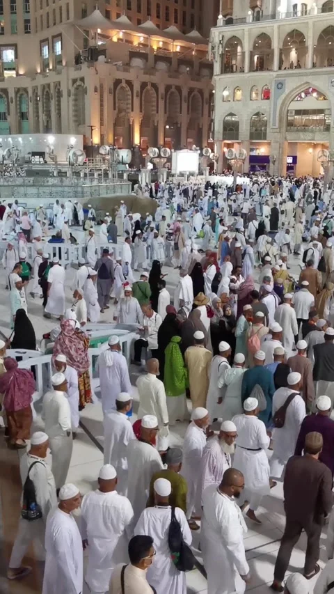 Pilgrims exit Al Haram mosque after a late evening prayers in Makkah, Stock Footage 274472751