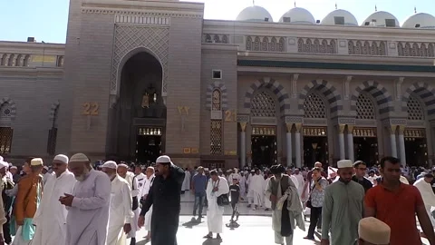 Pilgrims at Nabawi mosque Stock Footage