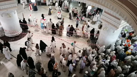 Pilgrims perform Saee or saie during of Hajj and Umra between Safa and Marwa Stock Footage 126087826