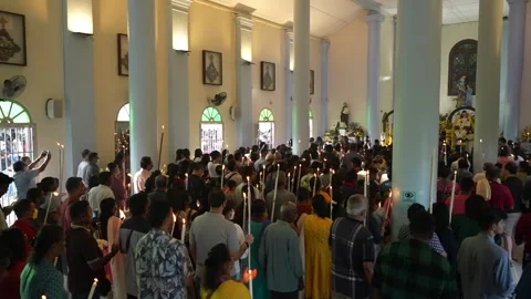 Pilgrims queue up to offering candles to St Anne Stock Footage 255419953
