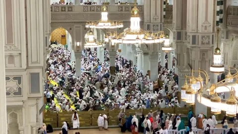 Pilgrims sitting inside Masjid al-Haram Makkah Stock Footage 332589027