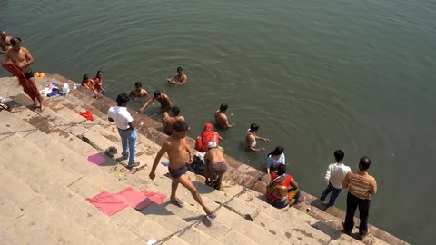 Pilgrims take bath in River Ganges 스톡 동영상 103421899