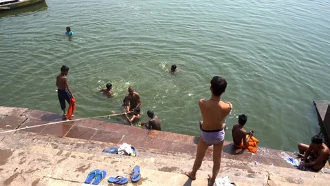 Pilgrims take bath in River Ganges 스톡 동영상 103421929